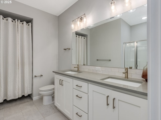 bathroom with tile patterned flooring, toilet, vanity, a shower with curtain, and backsplash