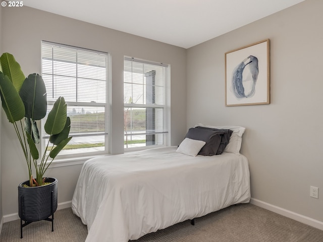 bedroom with light carpet