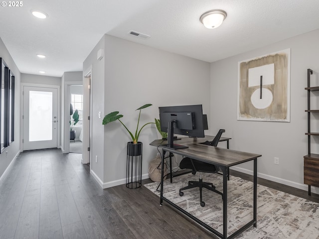 office area with a textured ceiling and wood-type flooring