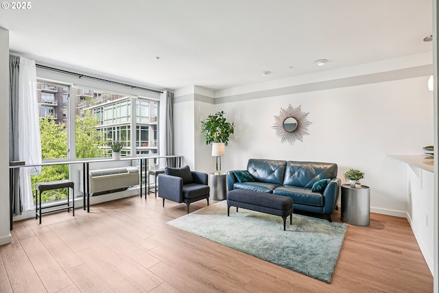 1125 NW 9th Ave Unit 427, Portland, OR 97209 - living area featuring wood finished floors and baseboards