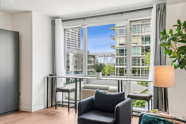 1125 NW 9th Ave Unit 427, Portland, OR 97209 - living area featuring wood finished floors and baseboards