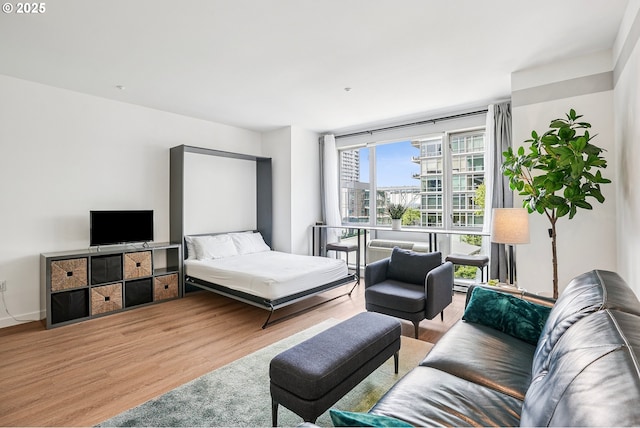 1125 NW 9th Ave Unit 427, Portland, OR 97209 - bedroom featuring wood finished floors