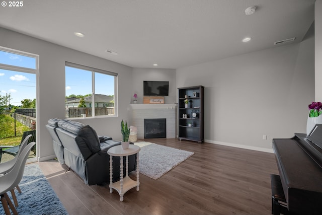 1012 NE 11th Ct, Battle Ground, WA 98604 - living area featuring a fireplace, wood finished floors, and recessed lighting