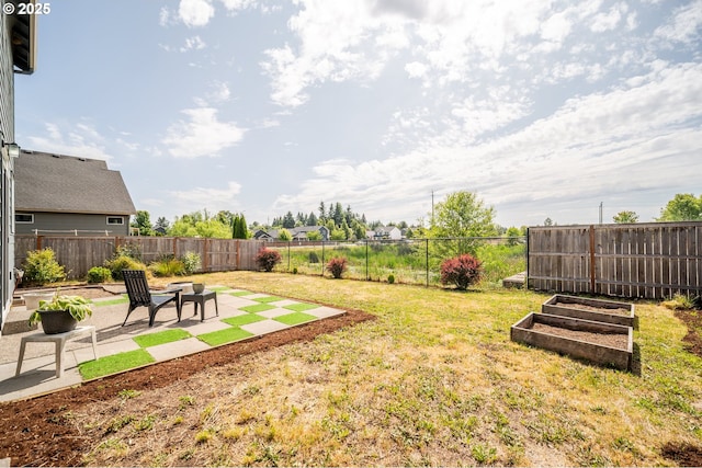 1012 NE 11th Ct, Battle Ground, WA 98604 - fenced backyard with a patio area and a garden