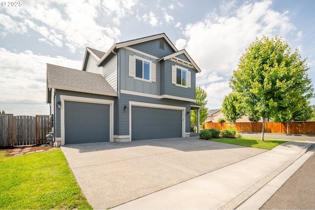 1012 NE 11th Ct, Battle Ground, WA 98604 - view of front of property featuring board and batten siding, driveway, and a garage