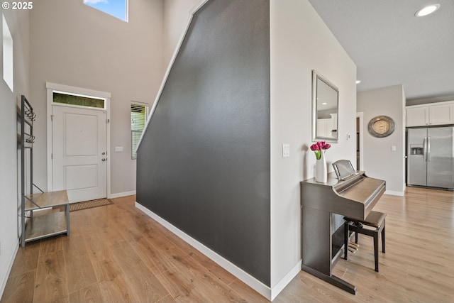 1012 NE 11th Ct, Battle Ground, WA 98604 - foyer with light wood-style flooring, recessed lighting, and a high ceiling