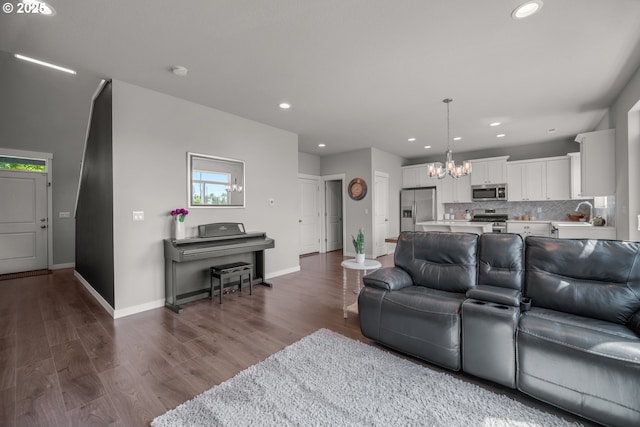 1012 NE 11th Ct, Battle Ground, WA 98604 - living room featuring a chandelier, recessed lighting, and dark wood finished floors
