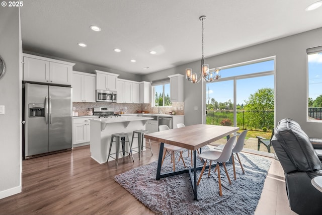 1012 NE 11th Ct, Battle Ground, WA 98604 - dining area with recessed lighting, a chandelier, and wood finished floors