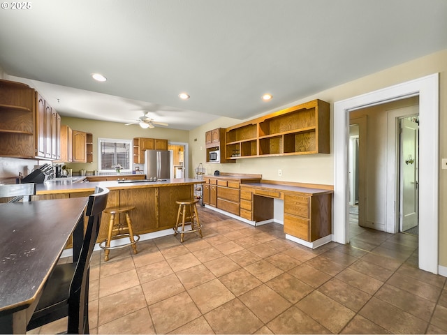 217 N Main St, Halfway, OR 97834 - kitchen featuring open shelves, appliances with stainless steel finishes, recessed lighting, a peninsula, and a ceiling fan