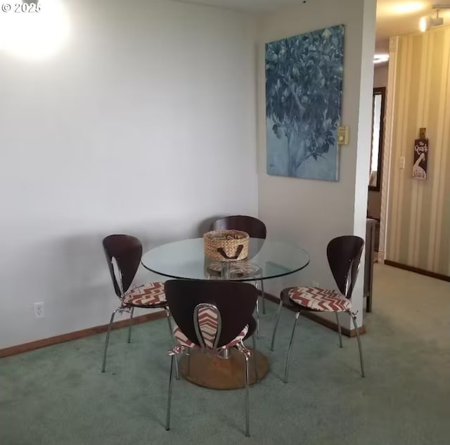 dining space with carpet flooring