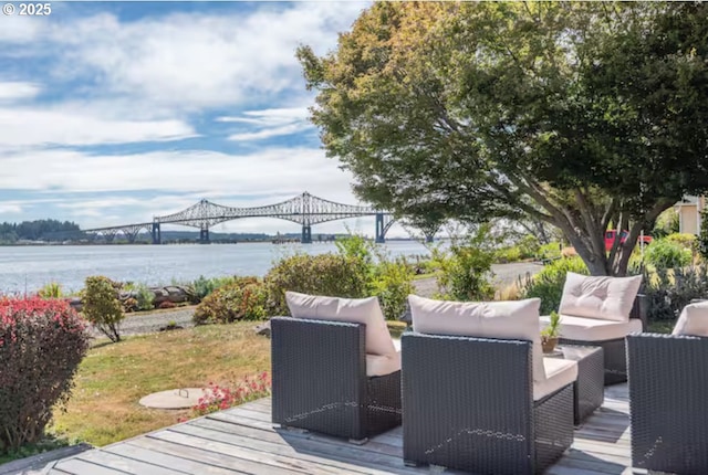 wooden terrace featuring a water view