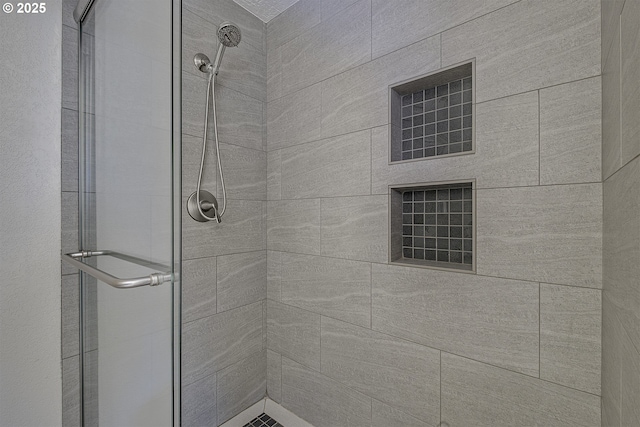 full bathroom featuring a shower stall