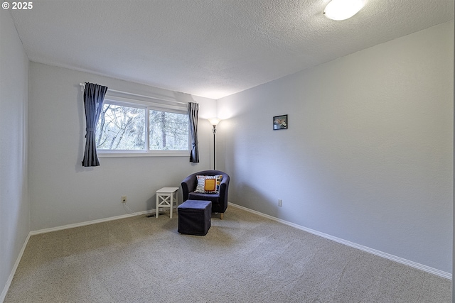 unfurnished room featuring baseboards, carpet floors, and a textured ceiling