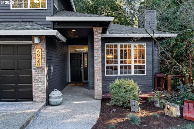 view of exterior entry featuring a garage