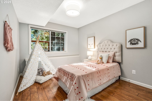 bedroom featuring dark hardwood / wood-style flooring