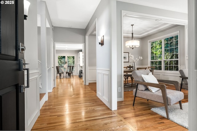 entrance foyer with a chandelier and light hardwood / wood-style flooring