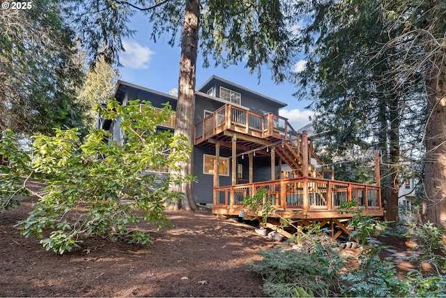 rear view of house featuring a deck