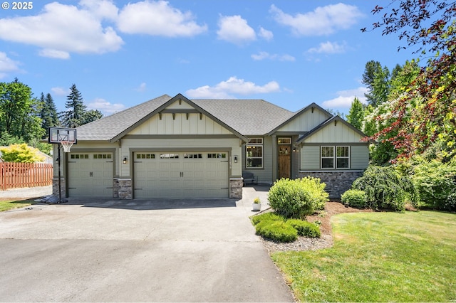 31870 SE Grace St, Gresham, OR 97080 - craftsman-style home featuring stone siding, board and batten siding, an attached garage, and concrete driveway