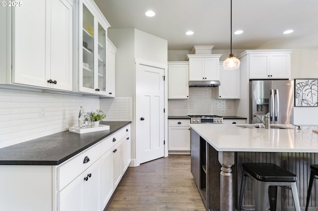 31870 SE Grace St, Gresham, OR 97080 - kitchen featuring stainless steel refrigerator with ice dispenser, decorative backsplash, white cabinetry, dark wood-style flooring, and recessed lighting