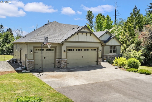 31870 SE Grace St, Gresham, OR 97080 - view of front of house with board and batten siding, an attached garage, stone siding, concrete driveway, and a shingled roof