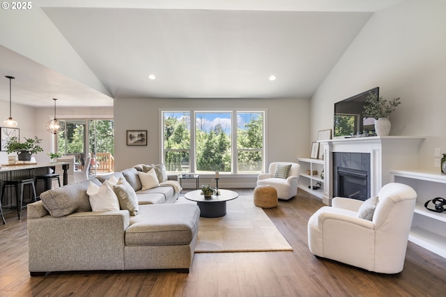 31870 SE Grace St, Gresham, OR 97080 - living room with wood-type flooring, recessed lighting, a tile fireplace, and high vaulted ceiling