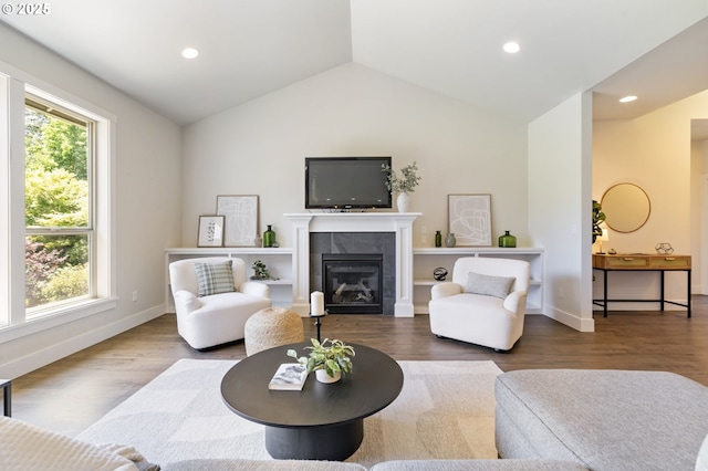 31870 SE Grace St, Gresham, OR 97080 - living area with vaulted ceiling, a tiled fireplace, wood finished floors, and recessed lighting
