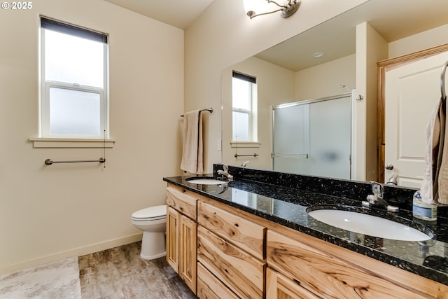 654 Wilson Ave, Cottage Grove, OR 97424 - full bathroom featuring a shower stall, double vanity, a sink, and wood finished floors