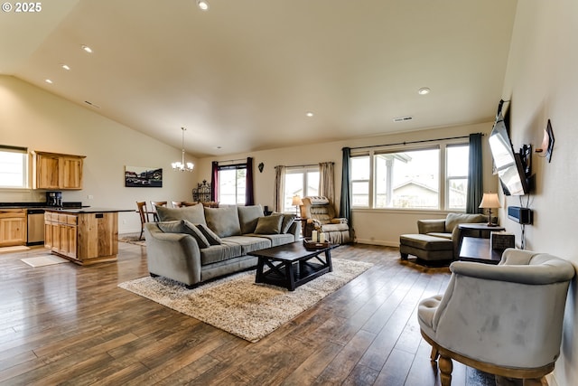 654 Wilson Ave, Cottage Grove, OR 97424 - living room featuring dark wood finished floors, visible vents, lofted ceiling, and a notable chandelier