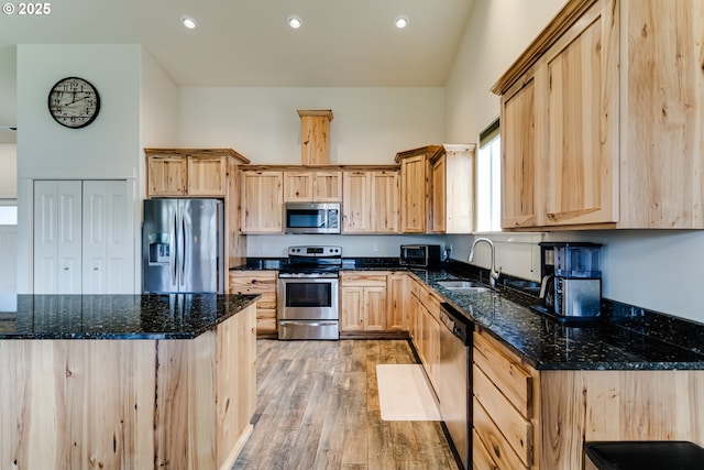 654 Wilson Ave, Cottage Grove, OR 97424 - kitchen featuring light brown cabinetry, a sink, dark stone countertops, light wood-style floors, and appliances with stainless steel finishes