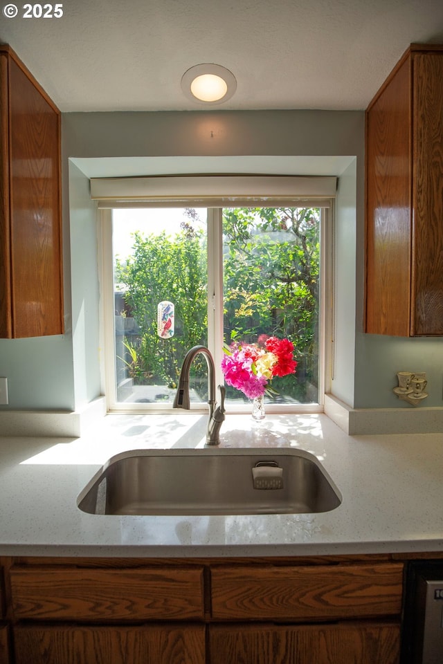 5825 Roma Ave, Cloverdale, OR 97112 - kitchen view of brown cabinetry and light stone countertops