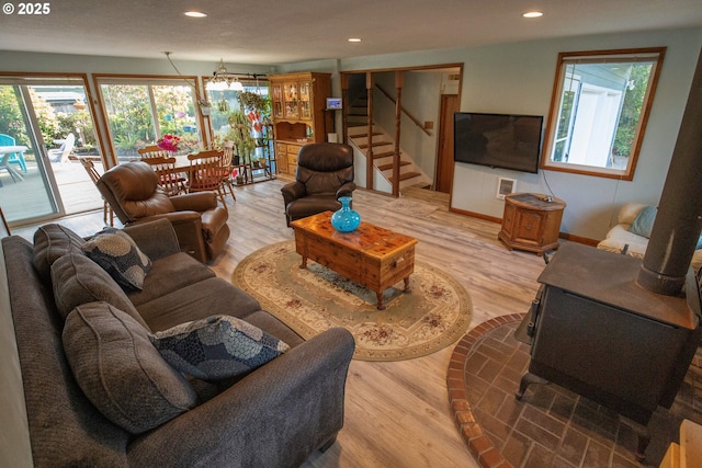 5825 Roma Ave, Cloverdale, OR 97112 - living room with light wood-style floors, stairway, recessed lighting, and a chandelier