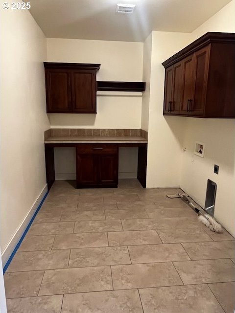 101 Rome St, Boardman, OR 97818 - laundry room featuring washer hookup, electric dryer hookup, cabinet space, and visible vents
