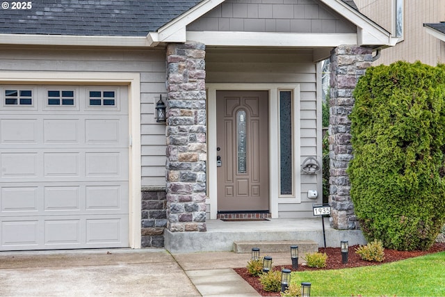 doorway to property featuring a garage