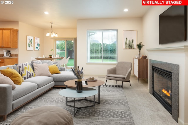 living room featuring light colored carpet and a notable chandelier