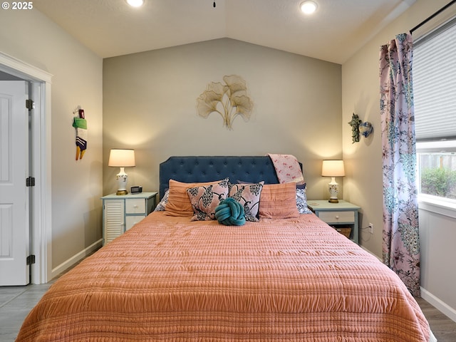 bedroom featuring vaulted ceiling