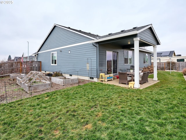 back of property with a yard, an outdoor hangout area, and a patio