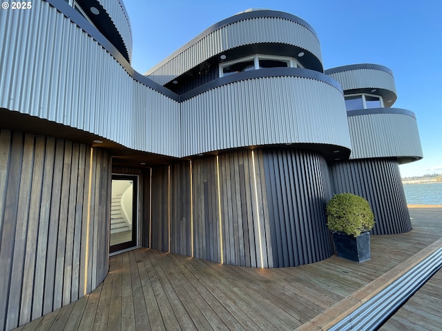 wooden deck with a water view