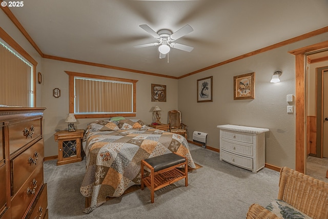 carpeted bedroom featuring crown molding and ceiling fan