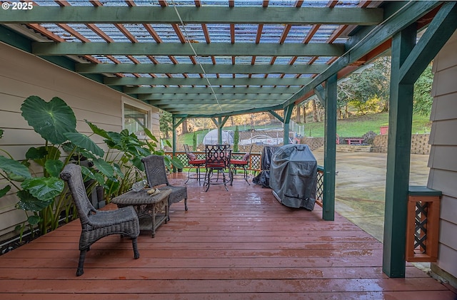 deck featuring area for grilling and a pergola