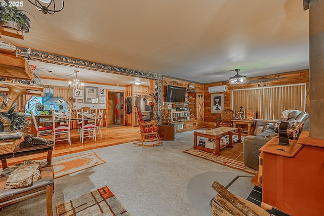 living room featuring carpet and a wall mounted AC