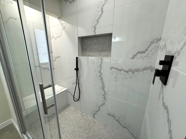 bathroom with a shower stall