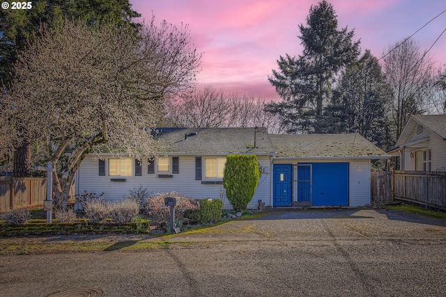 single story home with fence