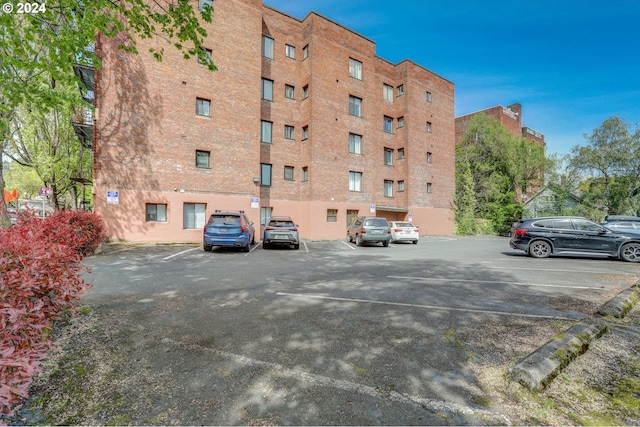 view of property featuring uncovered parking