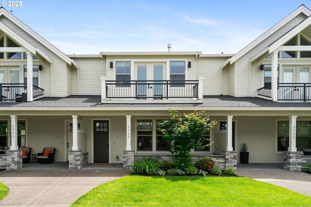 3935 NW 75th Ave, Camas, WA 98607 - view of front of house with a balcony, covered porch, french doors, and a front yard
