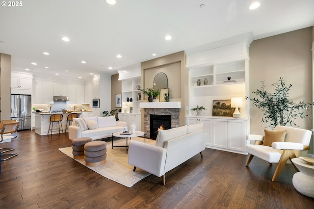3935 NW 75th Ave, Camas, WA 98607 - living room with dark wood-type flooring, a stone fireplace, and recessed lighting