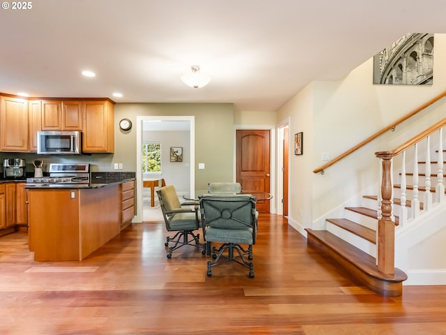 15700 SW Division St, Beaverton, OR 97007 - kitchen with appliances with stainless steel finishes, light wood-style flooring, recessed lighting, and a peninsula