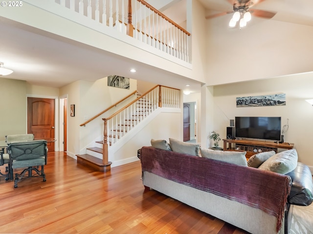 15700 SW Division St, Beaverton, OR 97007 - living room featuring stairs, wood finished floors, a ceiling fan, a high ceiling, and recessed lighting