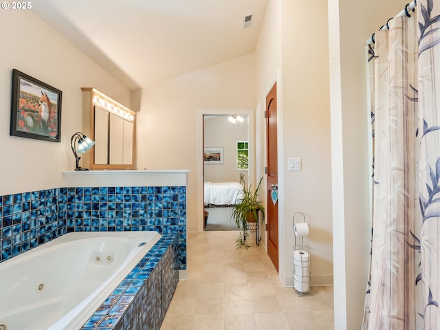 15700 SW Division St, Beaverton, OR 97007 - ensuite bathroom featuring a tub with jets, lofted ceiling, and tile patterned floors