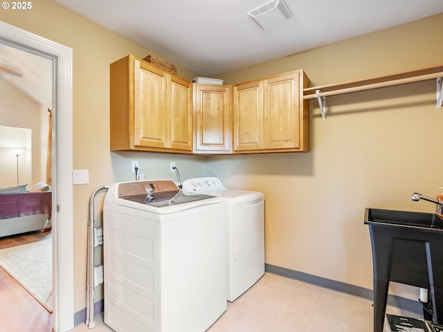 15700 SW Division St, Beaverton, OR 97007 - laundry room featuring washer and dryer, cabinet space, and light floors