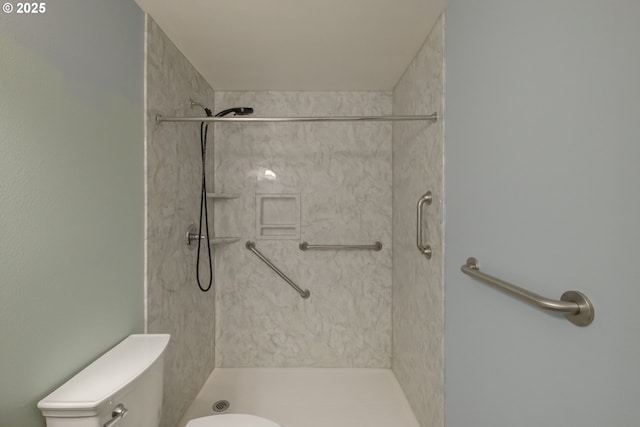 bathroom featuring toilet and walk in shower